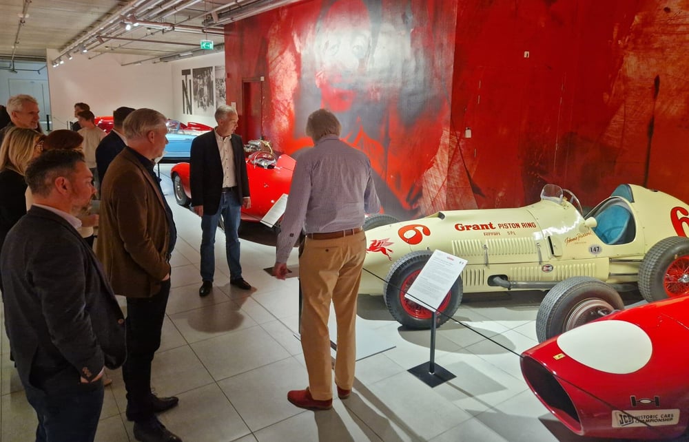 Bright Digital professionals visiting a motorsport museum and viewing classic race cars.